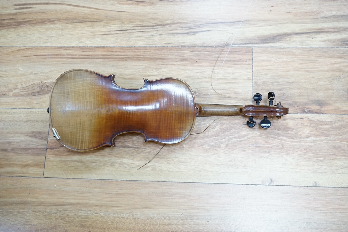 A quarter-size German violin, back measures 31cm. Condition - fair